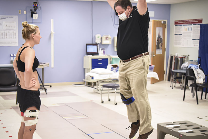 Patient with therapist in motion analysis center