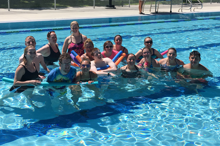 staff members and patients in pool