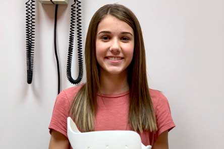 female patient wearing scoliosis brace