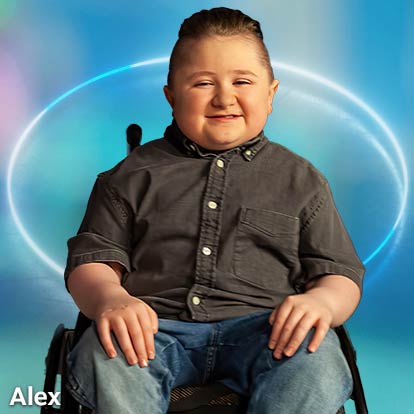 Male patient Alex sitting and smiling in wheelchair