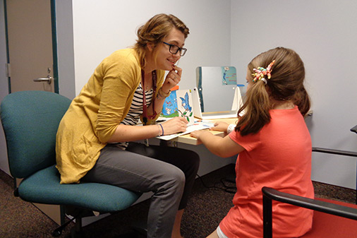 speech therapist working with patient
