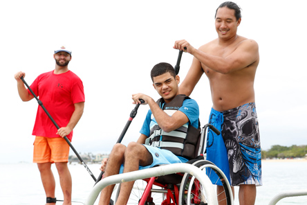 patient in wheelchair on paddleboard