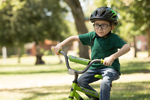 male scoliosis patient riding bicycle