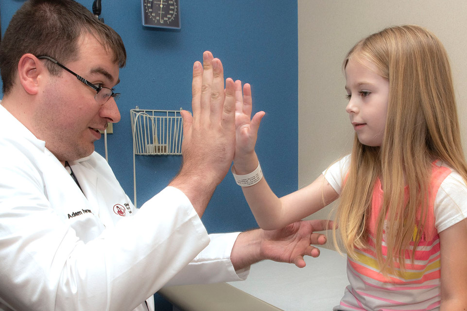 physician and patient high five