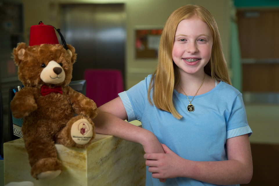 female patient with Fezzy bear