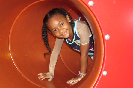female patient inside tunnel at playground