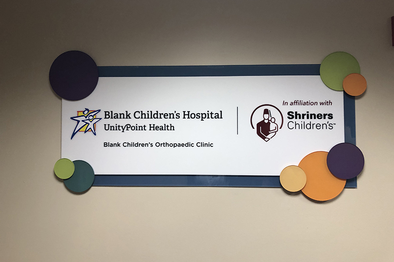 Blank Children's and Shriner Children's logos on wall plaque