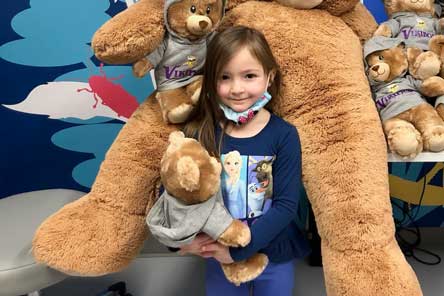 patient surrounded by Fezzy bears