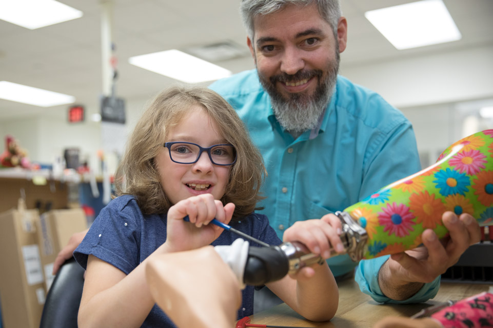patient and prosthetist working on prosthetic