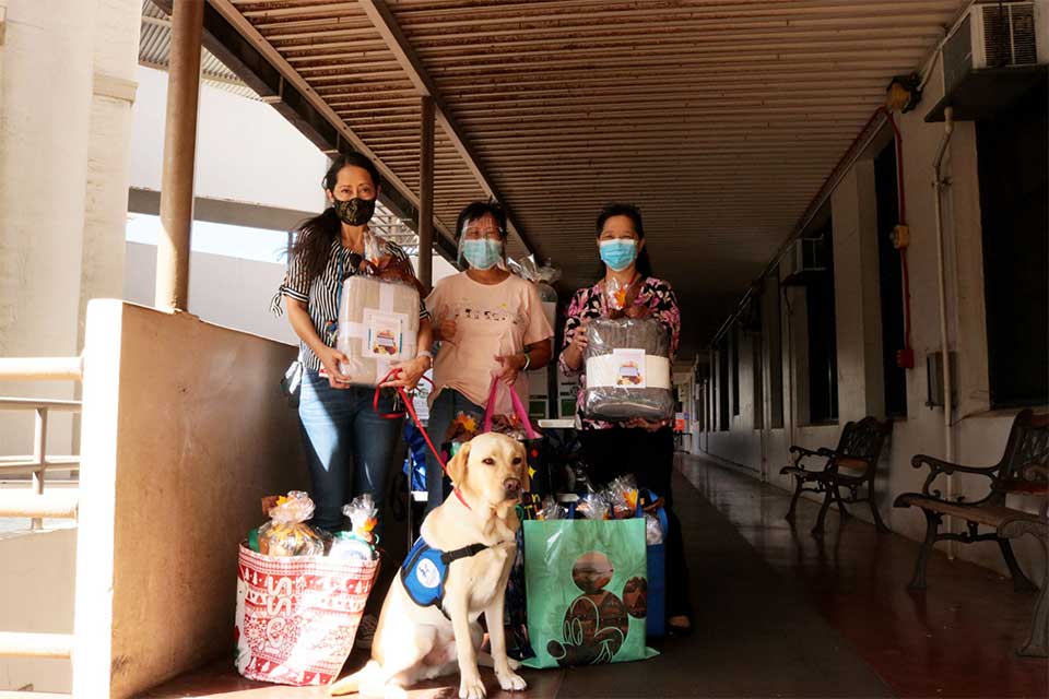 group and dog with donations honolulu
