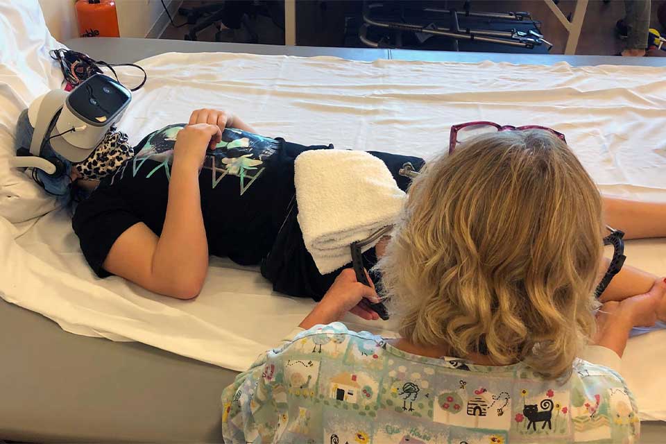 patient wearing VR goggles during therapy st louis
