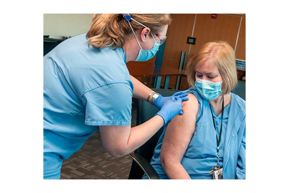 staff member receiving vaccine st louis