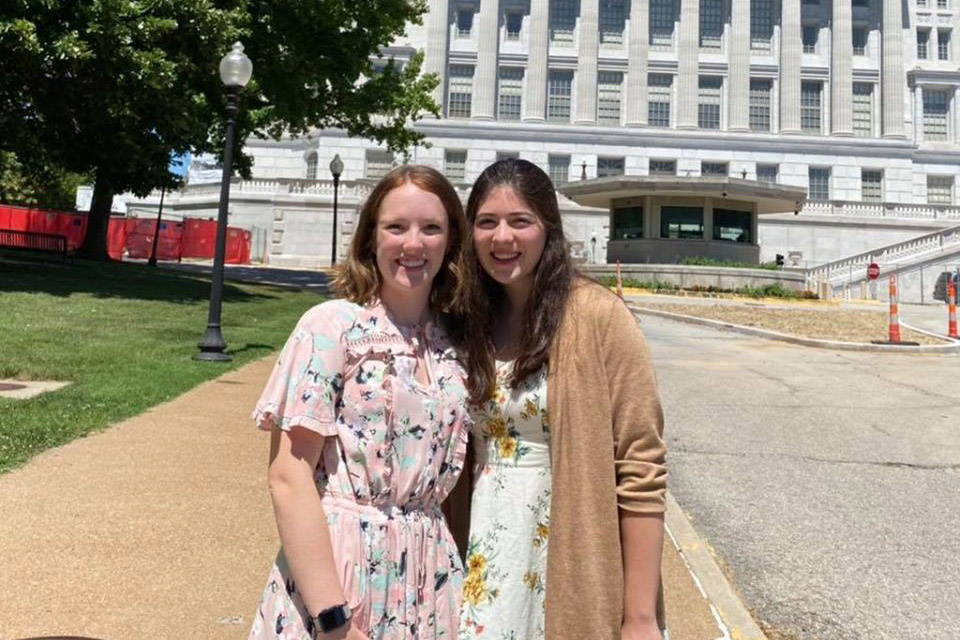 Madelyn and Katie in front of state house