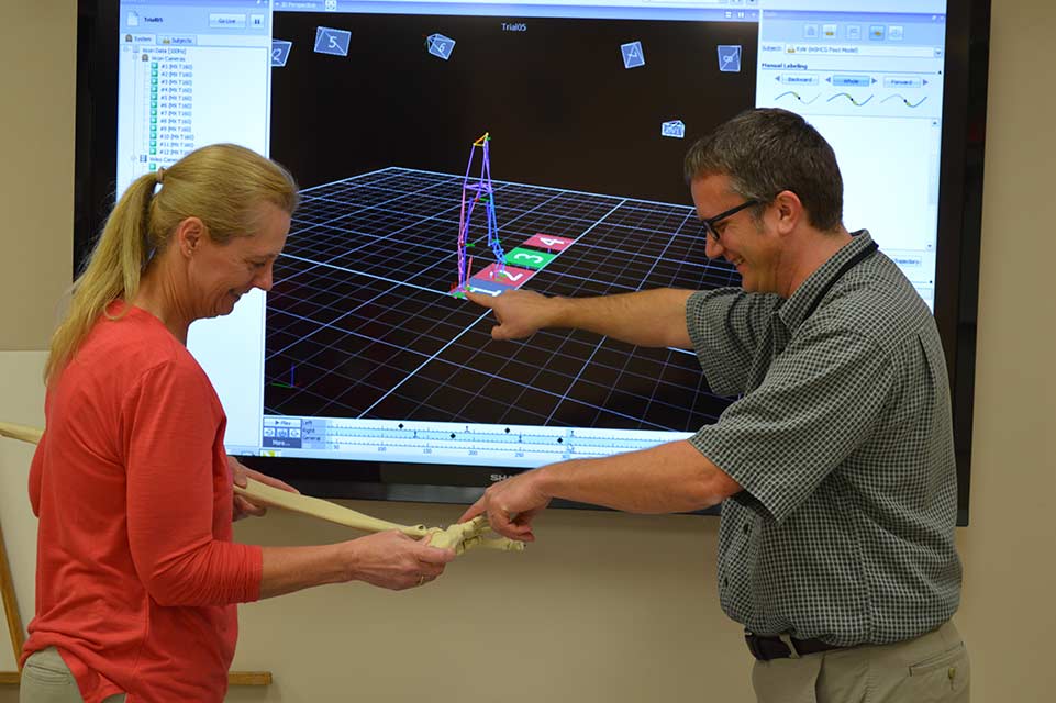 two specialists working in motion analysis center