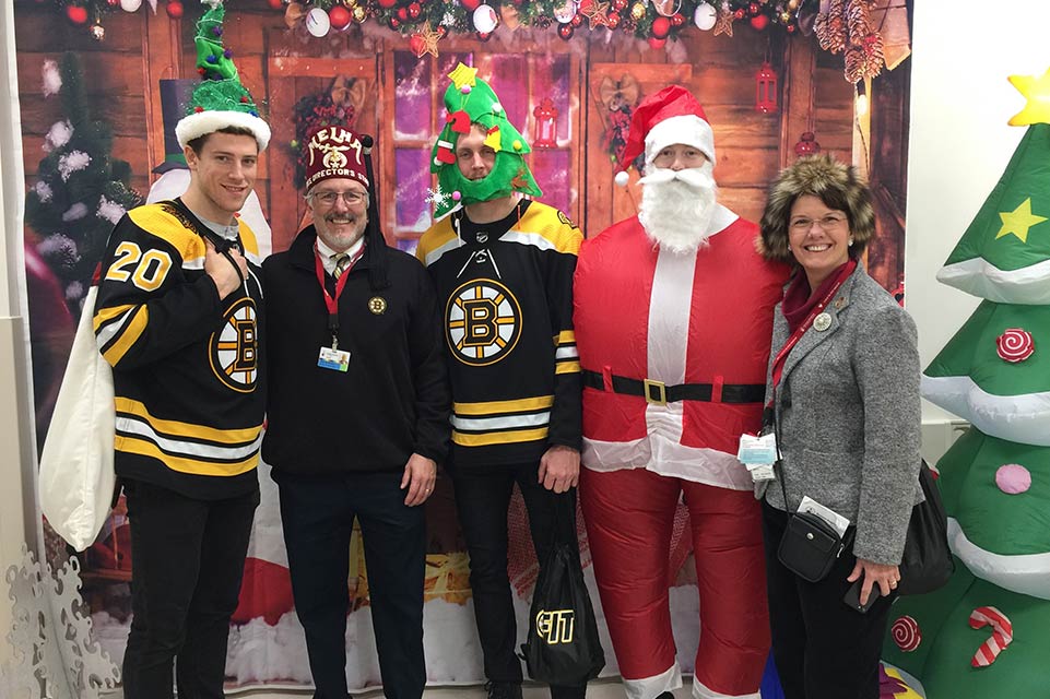 Dean, two hockey players, Santa, staff member