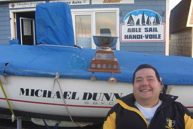 Richard next to his boat and trophy