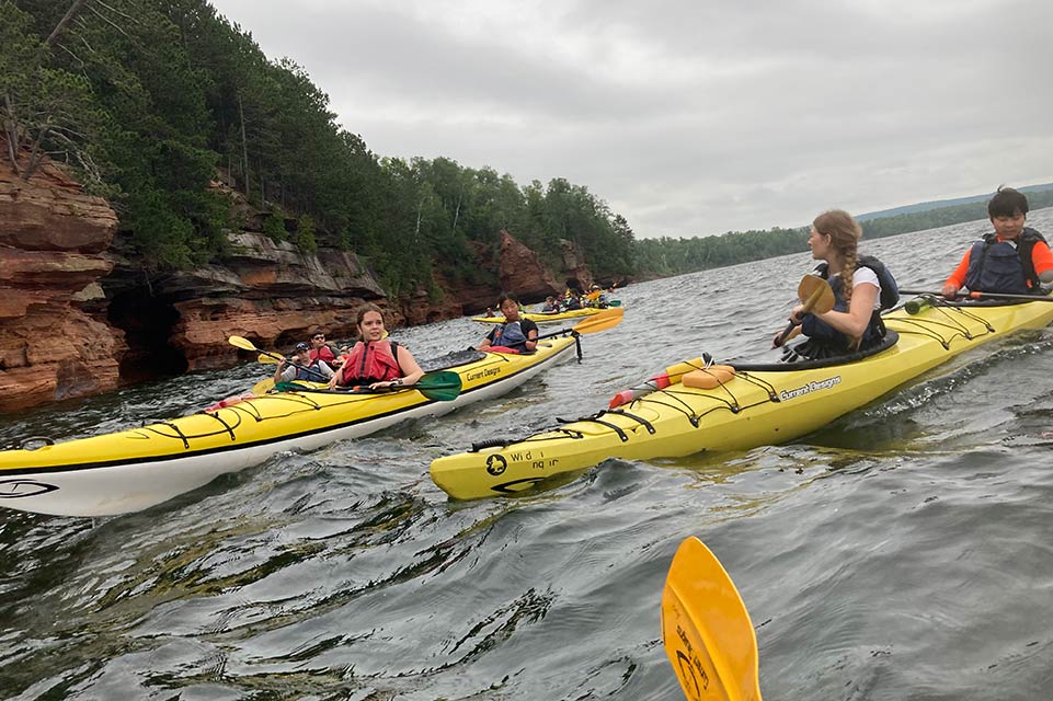 group of campers in kayaks
