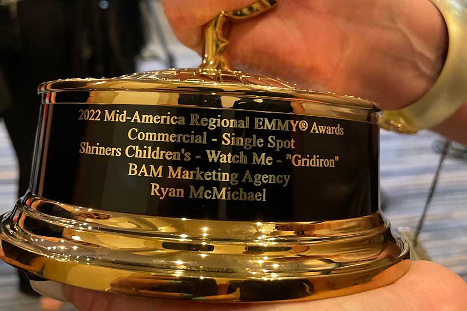 Base of the EMMY award with inscription that reads 2022 Mid-America Regional EMMY Awards Commercial - Single Spot Shriners Children's - Watch Me - "Gridiron" BAM Marketing Agency Ryan McMichael