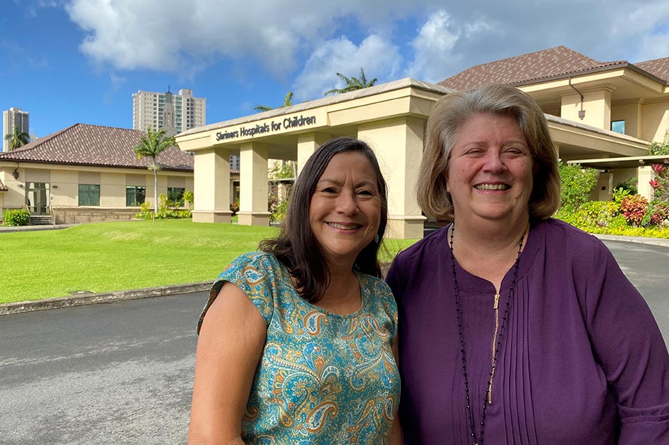 helena and cindy in front of shriners children's hawaii
