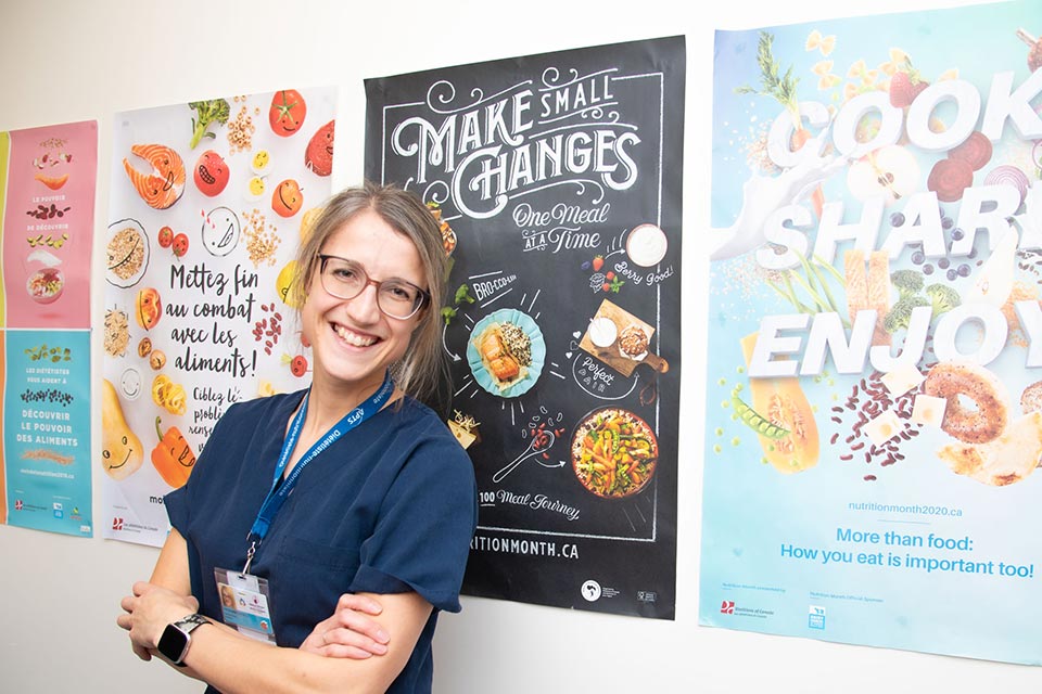 female dietitians, posters reading: "make small changes one meal at a time," broccoli, berry good, perfect, meat journey," cook, share enjoy, more than food: how you eat is important too!"