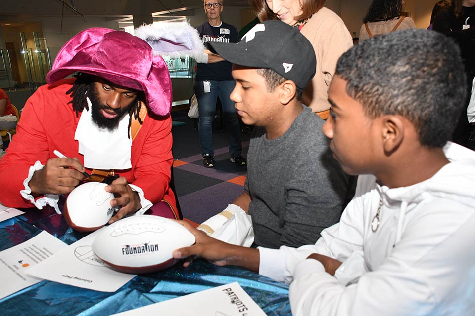 Patriots player signing autographs