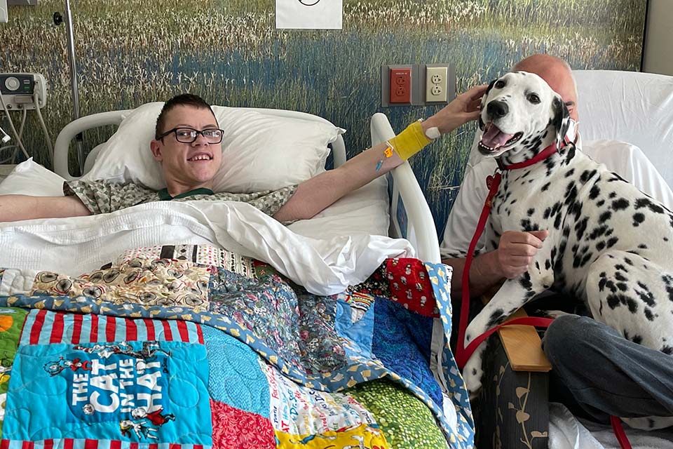 male patient and therapy dog