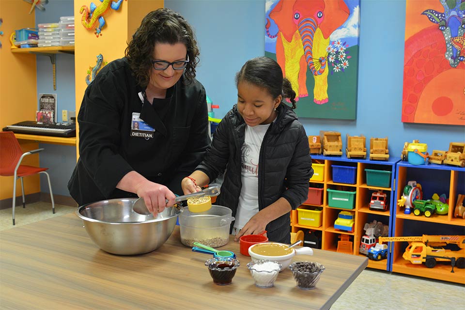 dietitian baking cookies with a patient