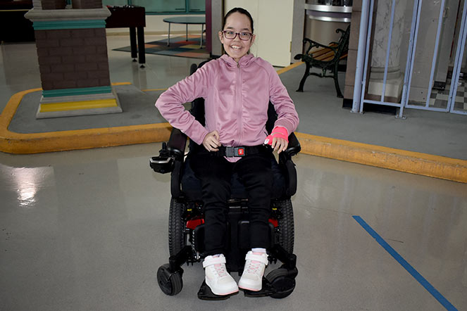 patient smiling in wheelchair