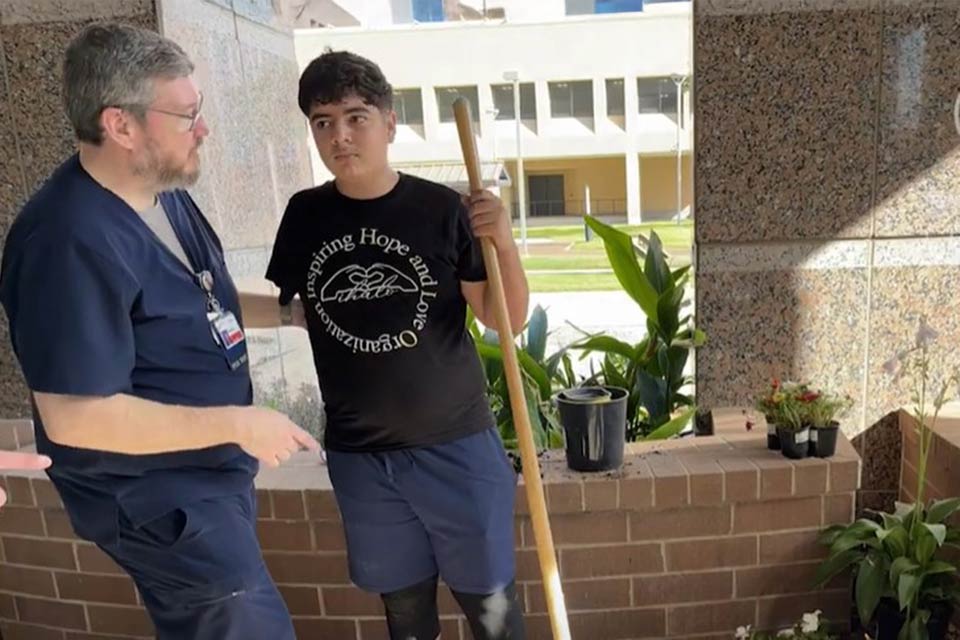 patient and provider outside gardening