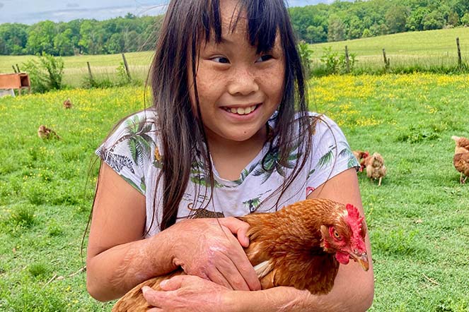 Sarah holding chicken