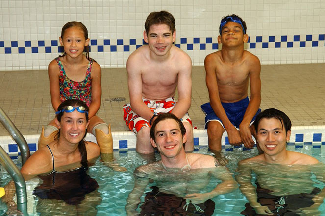 Elena at swimming camp, Camp Splash, held at Shriners Children's Twin Cities in 2006