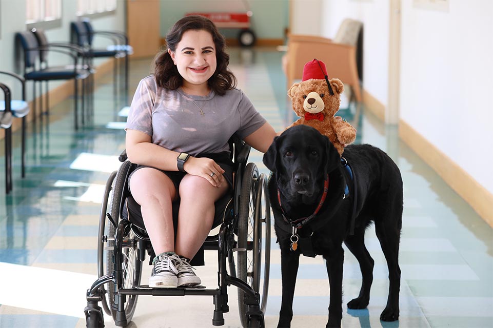 Leigh with her service dog, Nerf