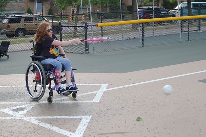 Riley playing adaptive softball