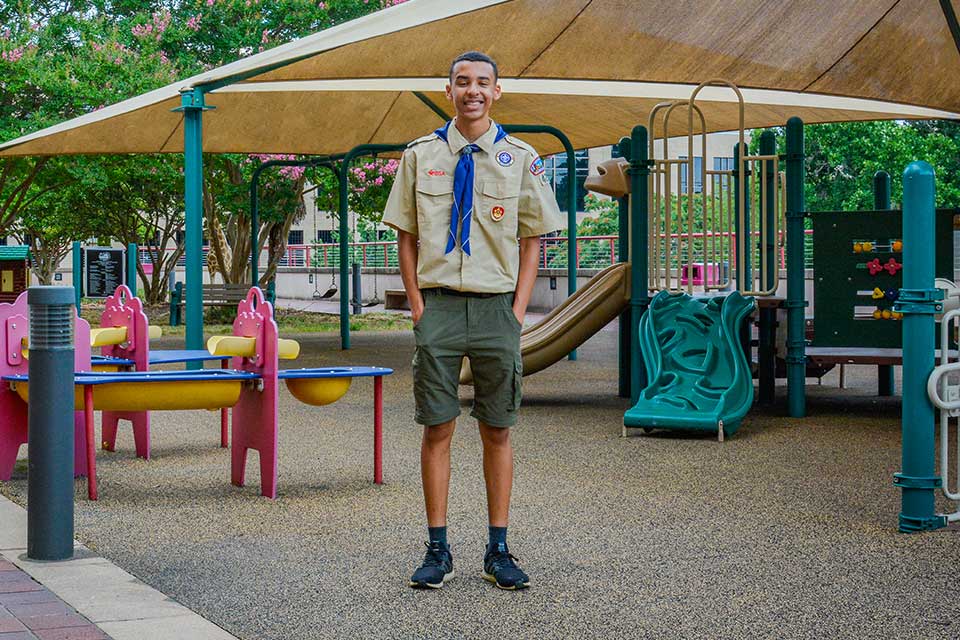 Shane standing on playground