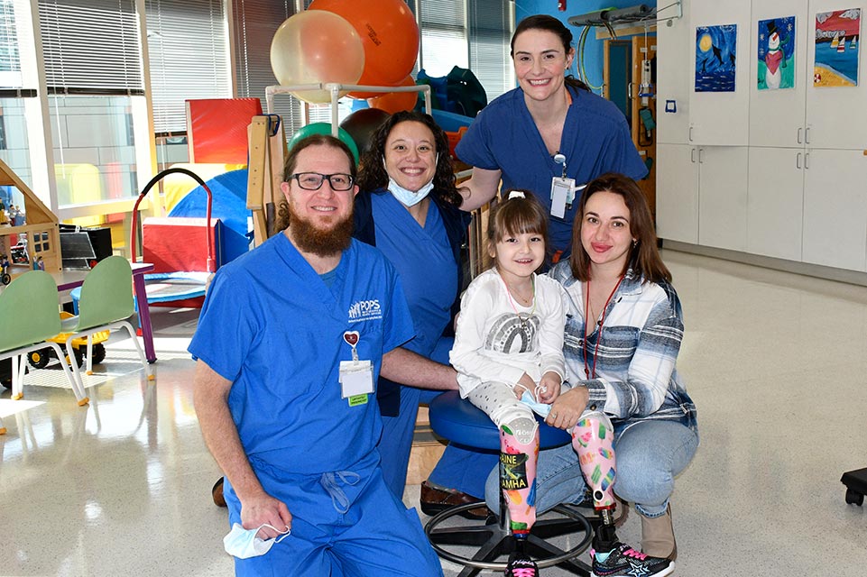 karolina and family member with her care team