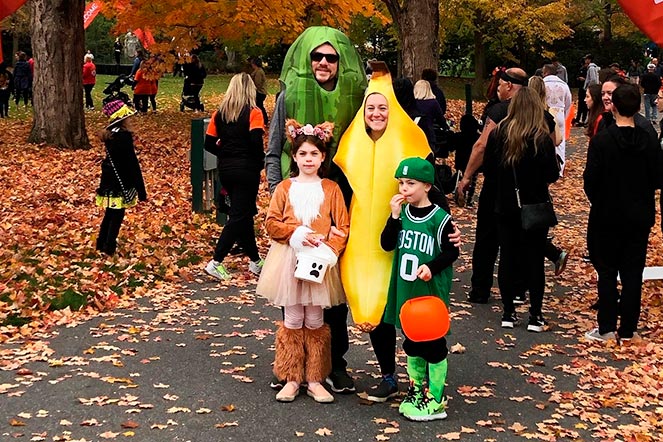 Emily with family, all dressed in costumes