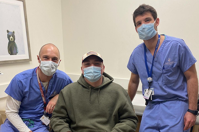 Hunter with two physicians