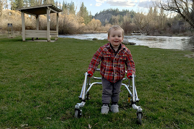 Young Mason using walker