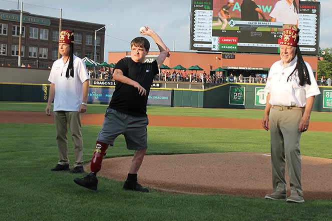 two Shriners and gavin in ballpark, Gavin throwing first pitch