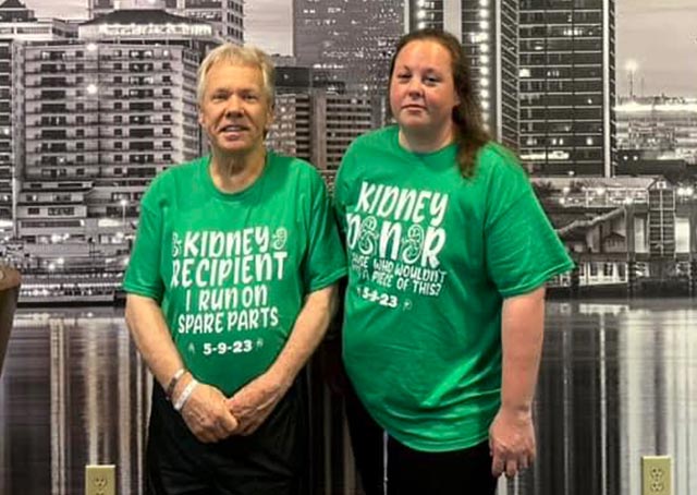 Dave and Krystal, Dave shirt reads "Kidney recipient, I run on spare parts." Krystal shirt reads "Kidney donor."