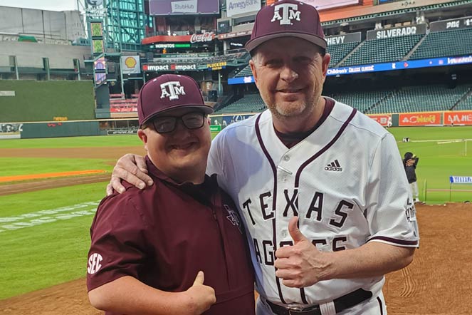 zach with baseball coach at game