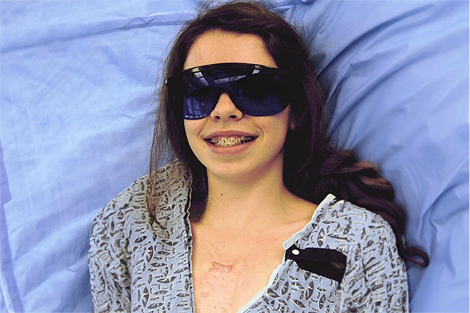 patient with glasses recovering from laser treatment