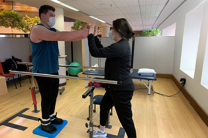 Patient working with physical therapist