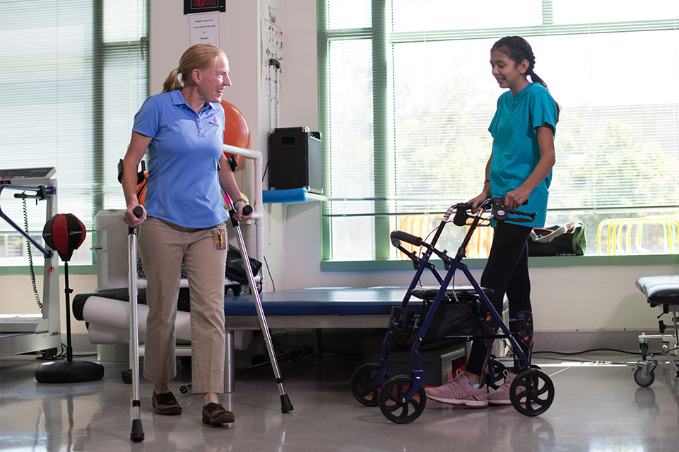 Spinal cord injury patient and therapist during therapy session