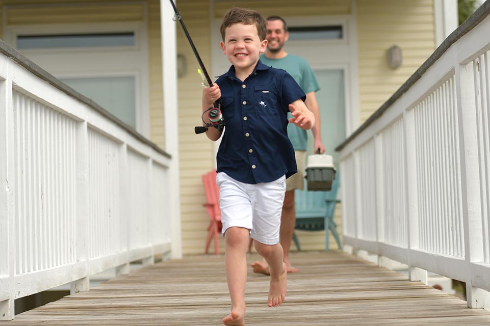 male child with fishing pole