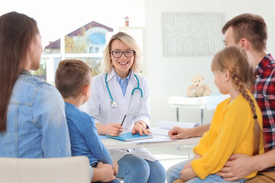 family speaking with physician