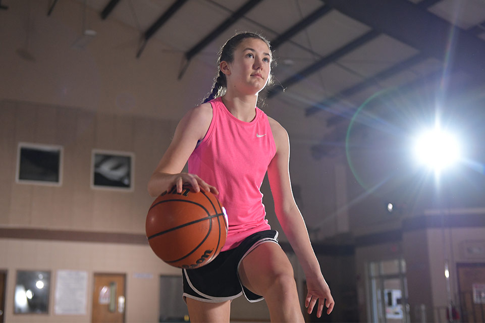 female patient playing basketball