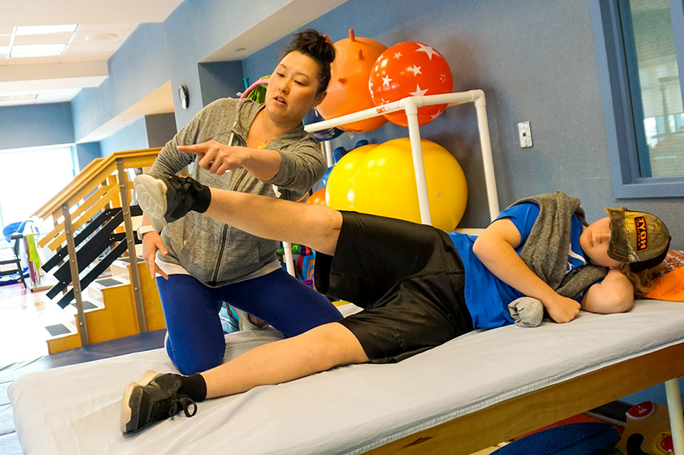 patient and therapist during physical therapy session