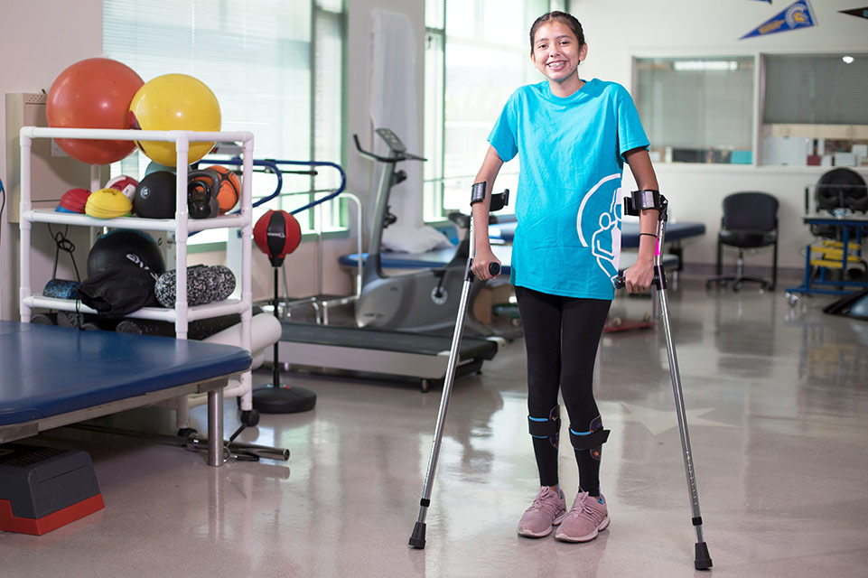patient on crutches in therapy gym