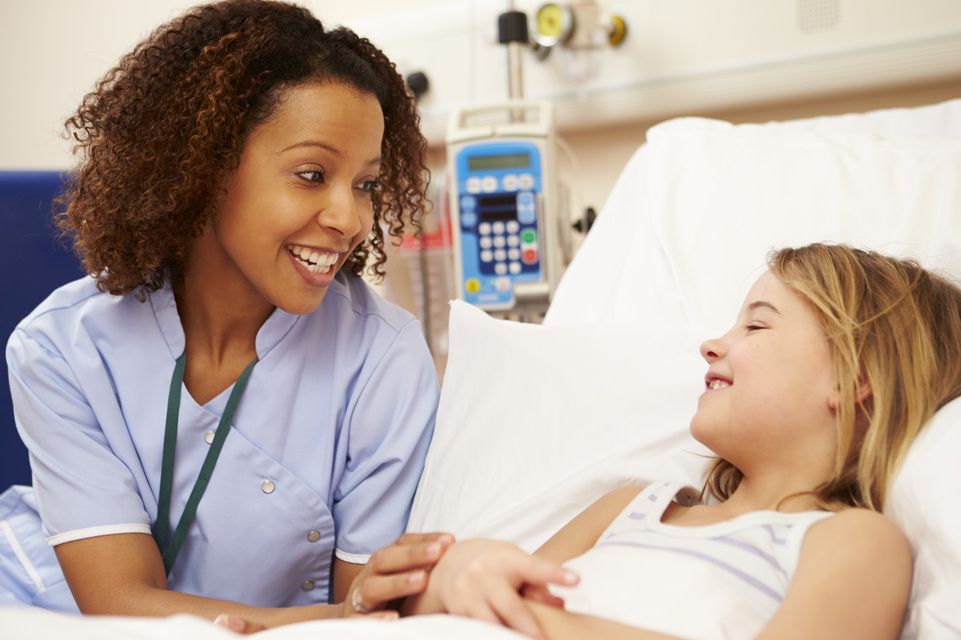 nurse speaking with female patient